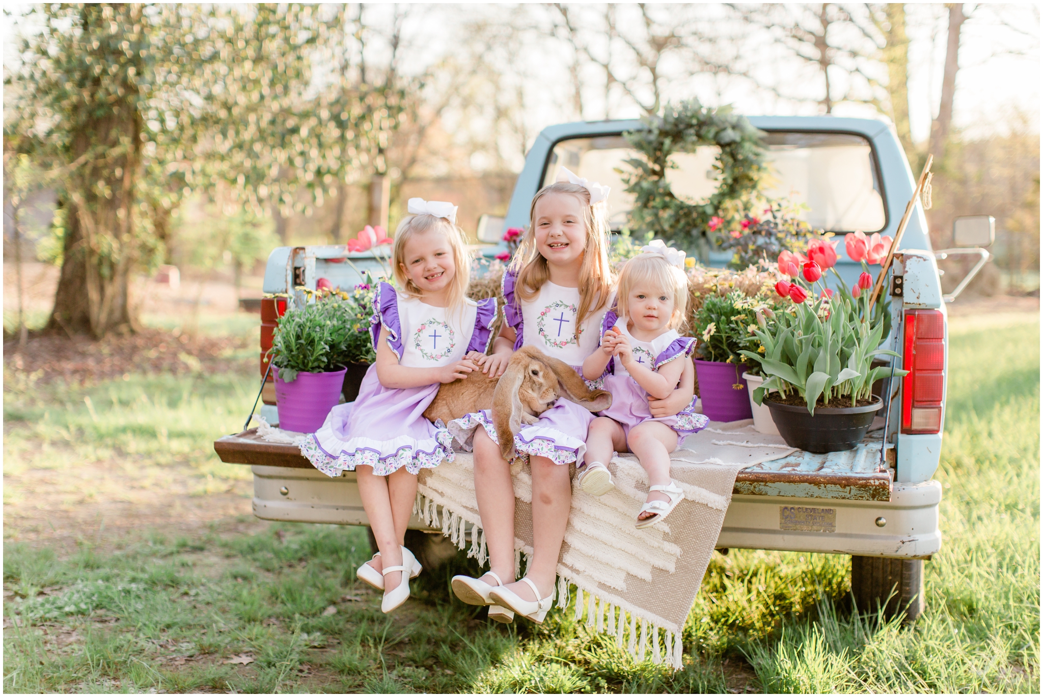 spring minis at red's hay farm with live bunnies and an antique truck with family photographer alyssa rachelle photography